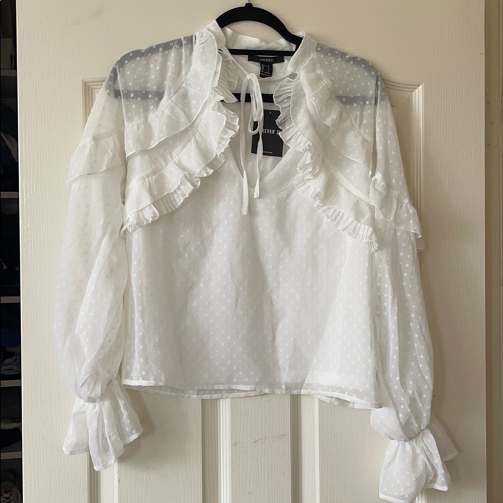 Polka dot blouse with ruffles